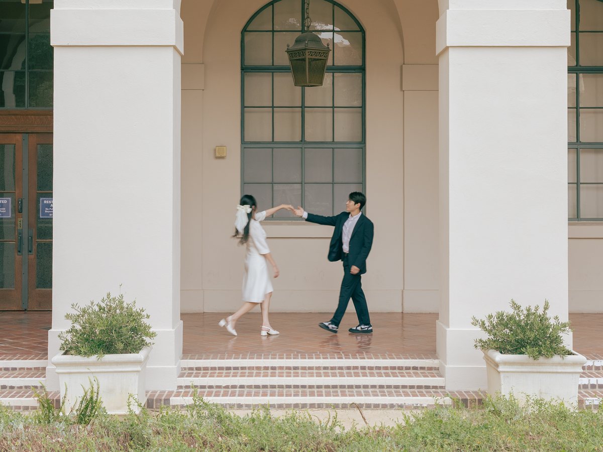 Jane and Timothy dancing under the arches